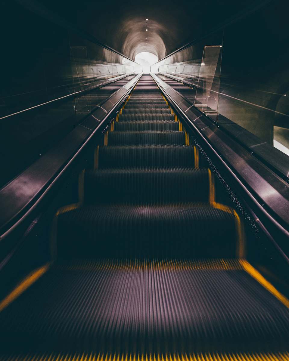 tunnel escalator moving upward the broad